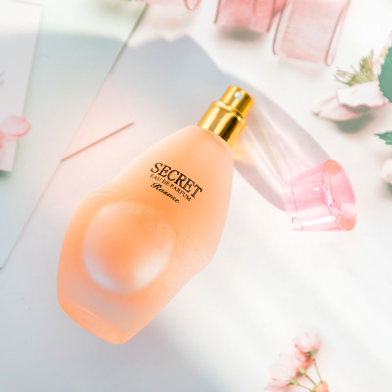 Model holding Paris Night women's perfume