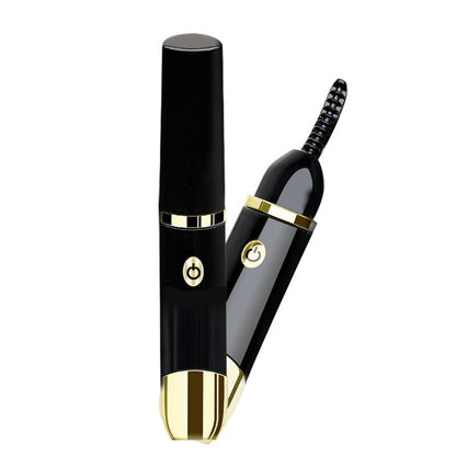 Using electric heated eyelash curler on lashes
